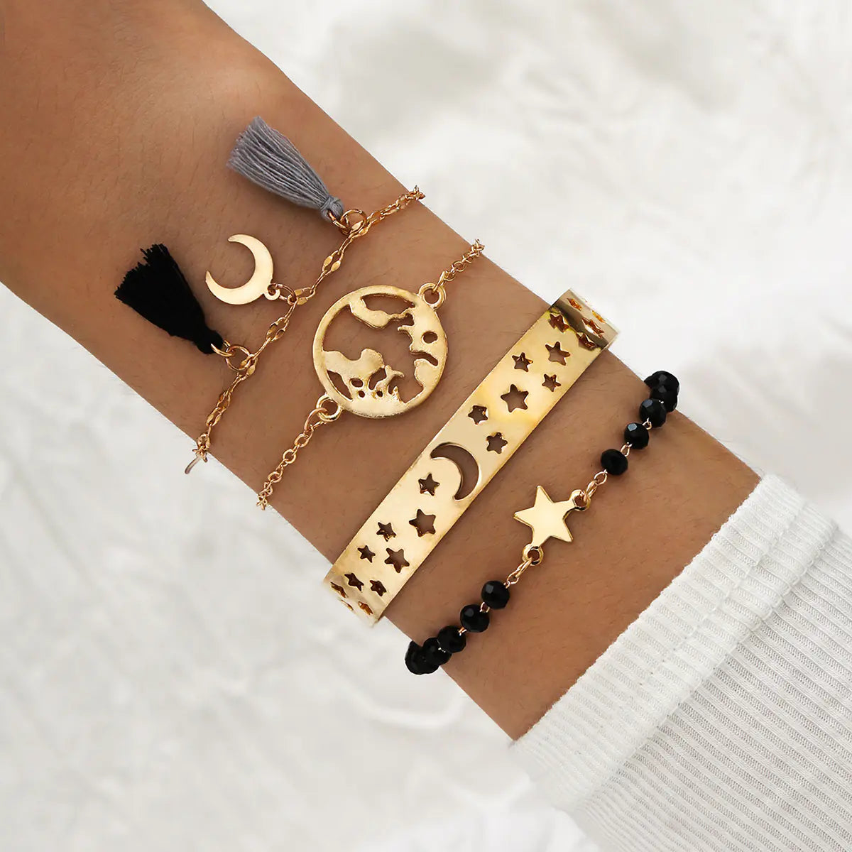 Set of 4 Boho Bracelets with Stars, Moons, and Leaves